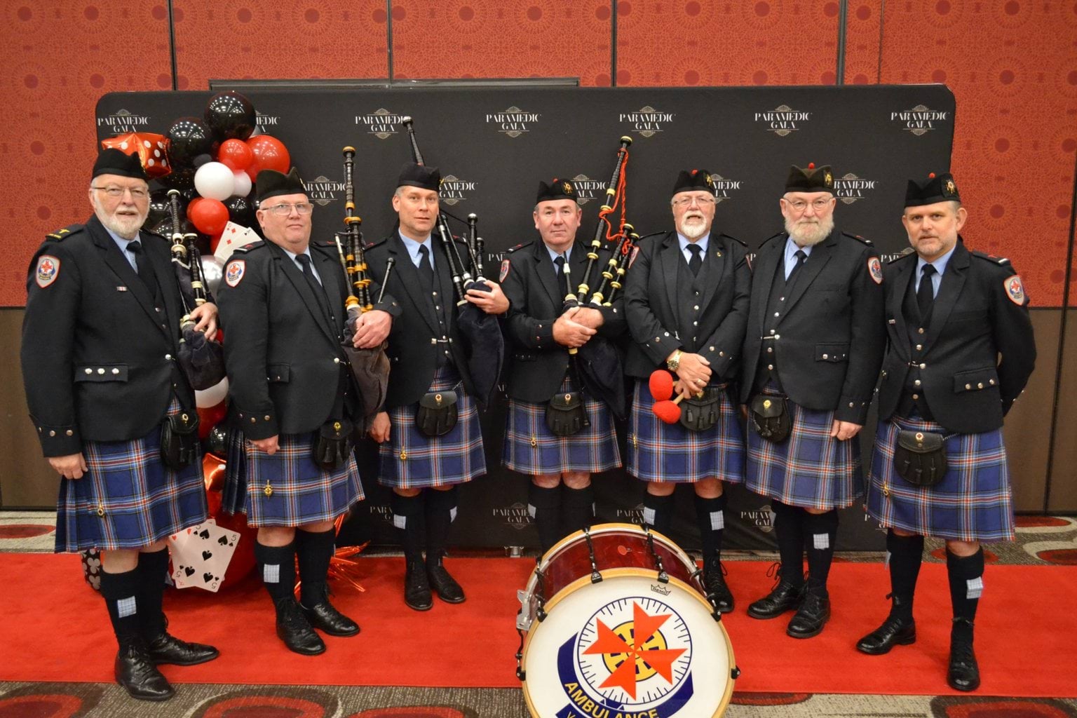 Members of the AV Pipes and Drums pose together at the Paramedic Gala