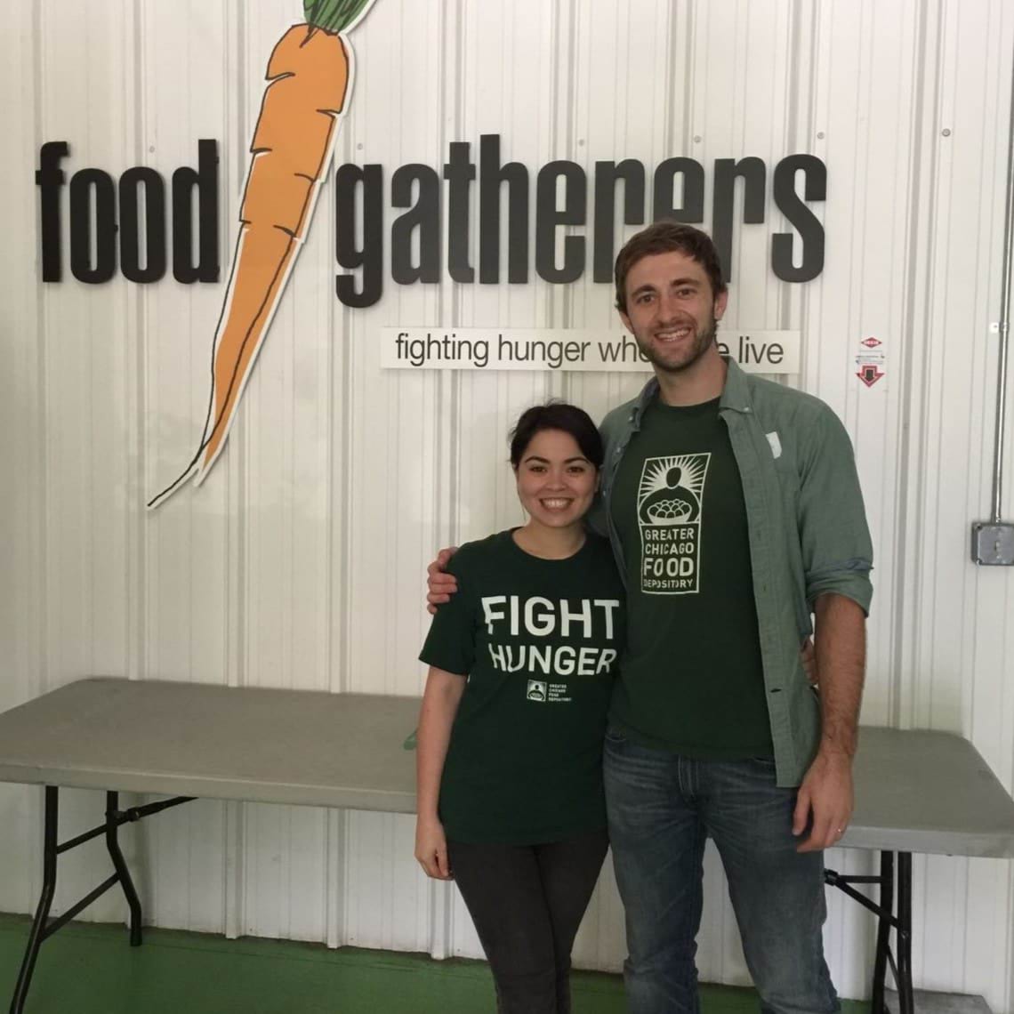 A man and woman wear Fight Hunger t-shirts.