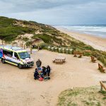 Ambulance Victoria attending to a patient on the beach