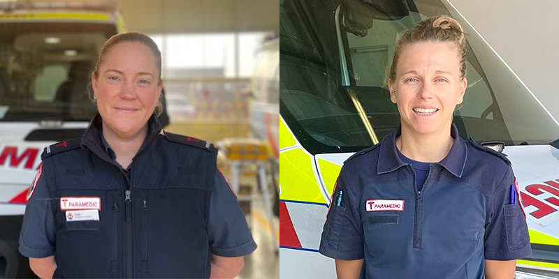 Two female paramedics standing in front of the ambulance.