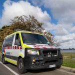 Ambulance Victoria ambulance parked beside a lake