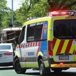 ambulance trying to make its way through traffic